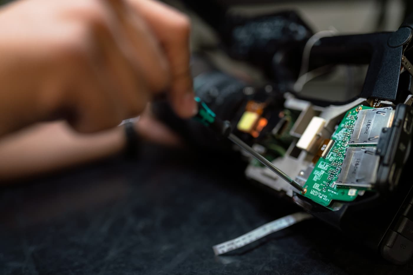 Technician servicing electronic security equipment